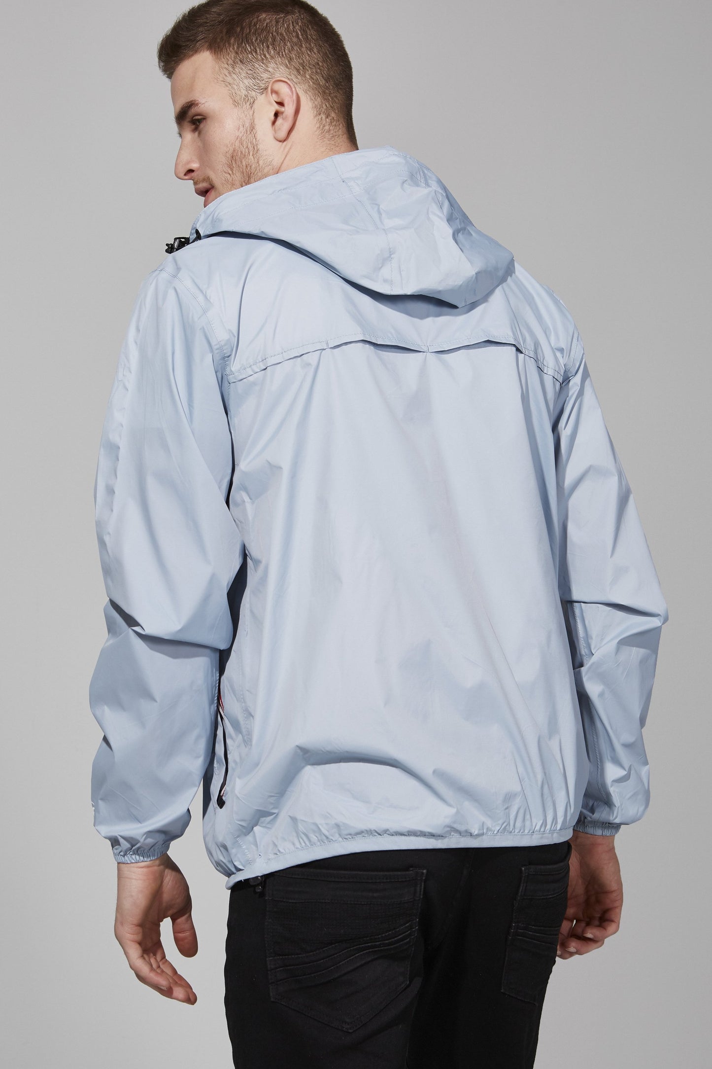 Full zip packable rain jacket and windbreaker in celestial blue